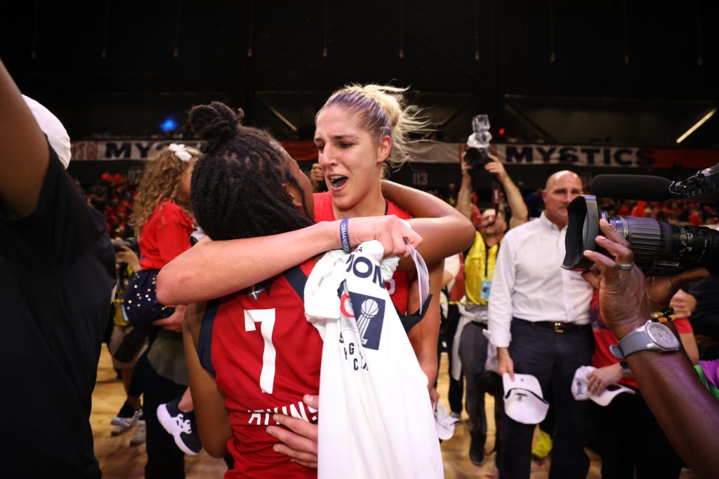 Elena Delle Donne and Ariel Atkins hug after winning the WNBA Championship.