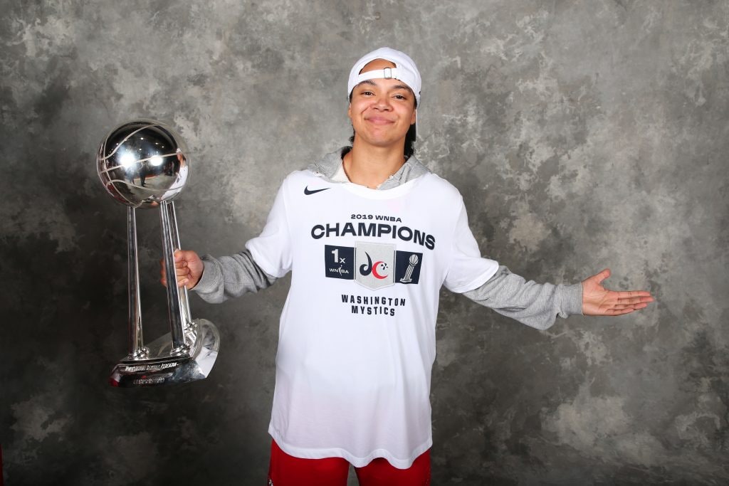 Kristi Toliver poses with the WNBA Finals trophy after winning her second WNBA Championship.