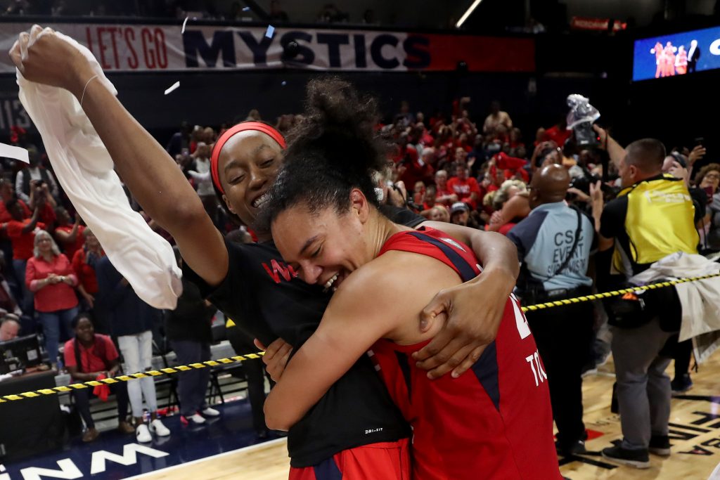 Shatori Walker-Kimbrough and Kristi Toliver celebrate.